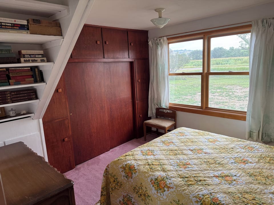 Main floor master bedroom with view of rolling hills.