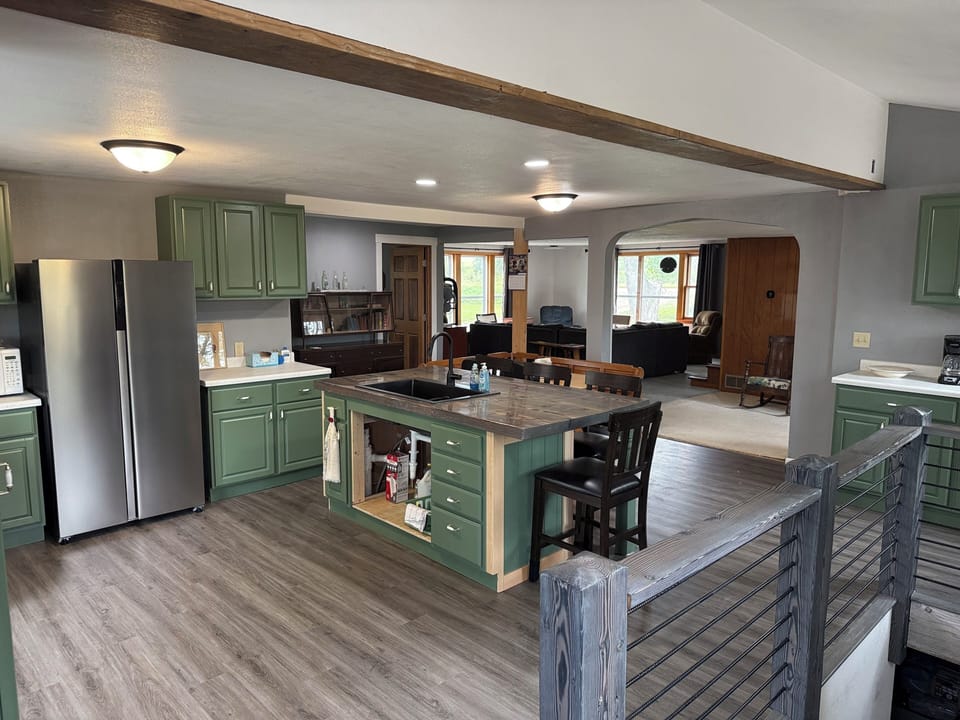 Full kitchen and living room view.