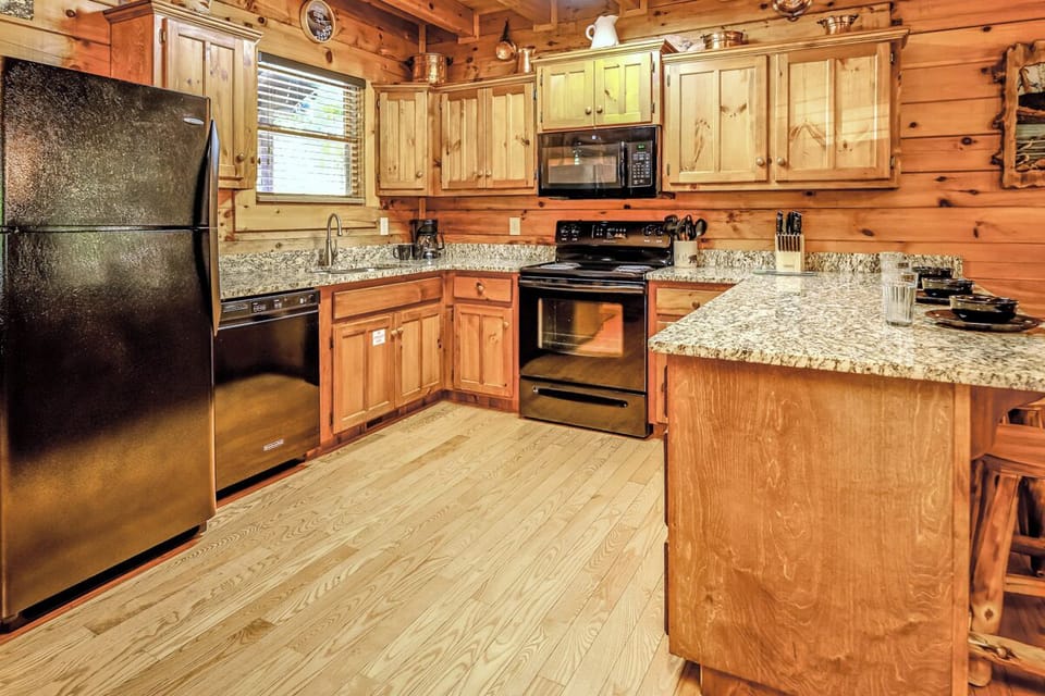 Prepare meals with ease in the well-equipped kitchen, complete with granite countertops, stainless-steel appliances and all the essentials needed for cooking and dining.