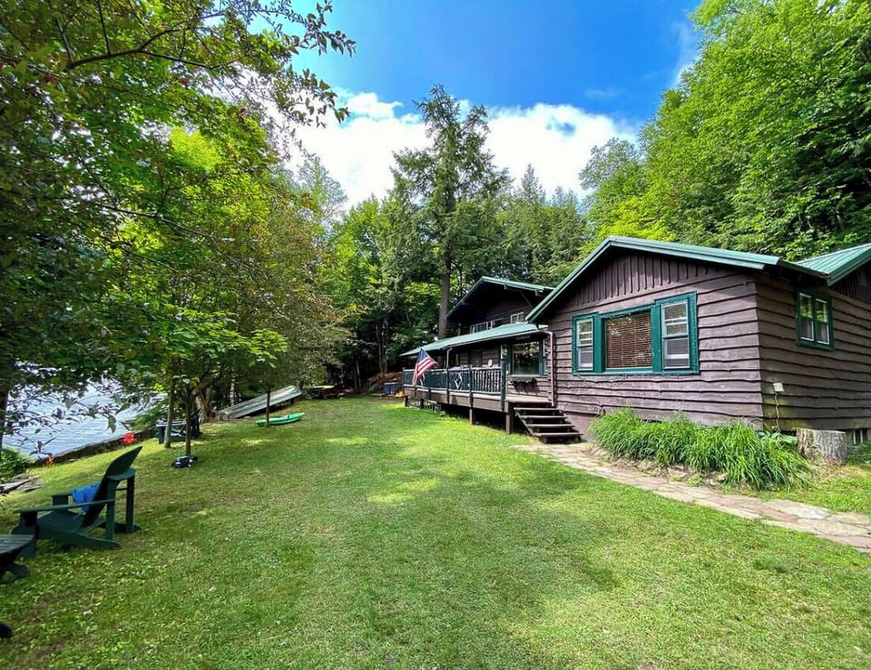 View of the house and the lake from the parking area. 