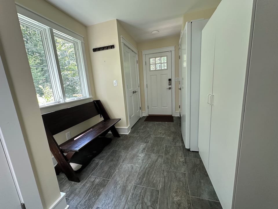 Mudroom with dog wash and side entry from deck