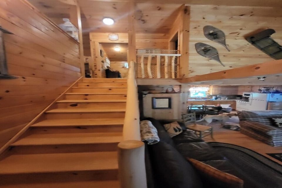 Stairs leading to loft, upstairs bathroom, & upstairs bedroom