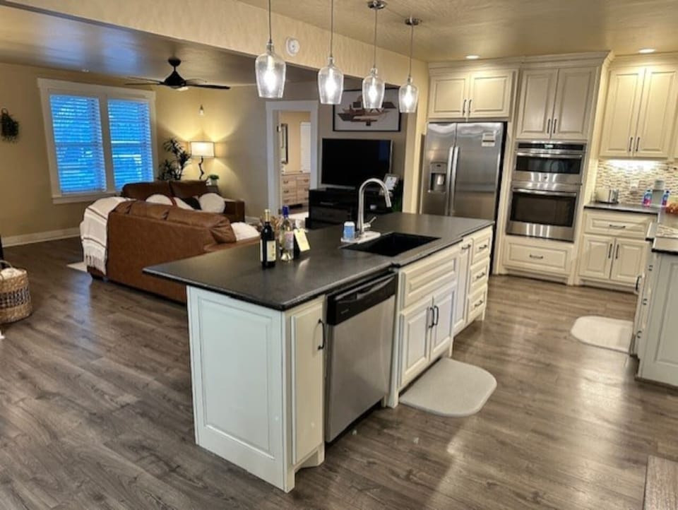 The Kitchen is the Core gathering place for your friends and family, with a spacious open concept living area with plenty of counter space.  Fully stocked Coffee & Tea Bar - all the comforts of home. 