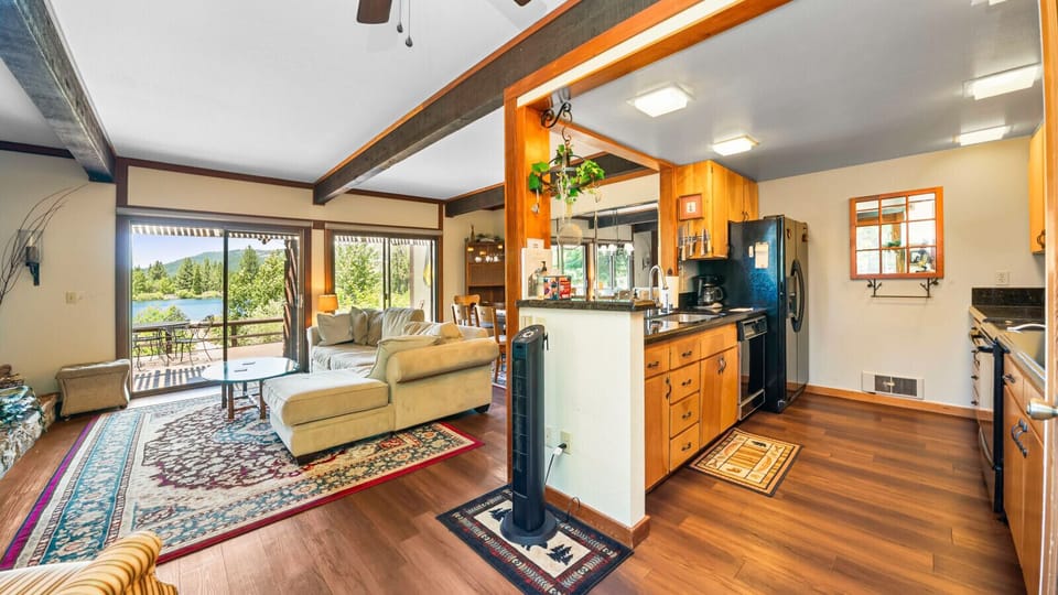 Kitchen opens to living with stunning views
