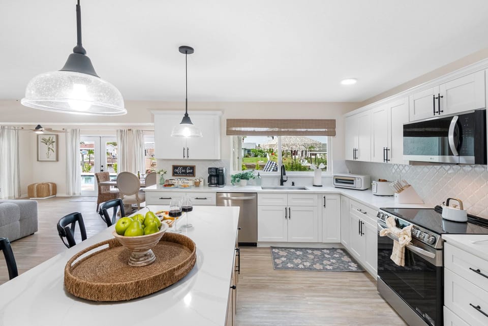 The open design makes this kitchen the heart of the home, ideal for gathering over morning coffee or preparing family dinners.