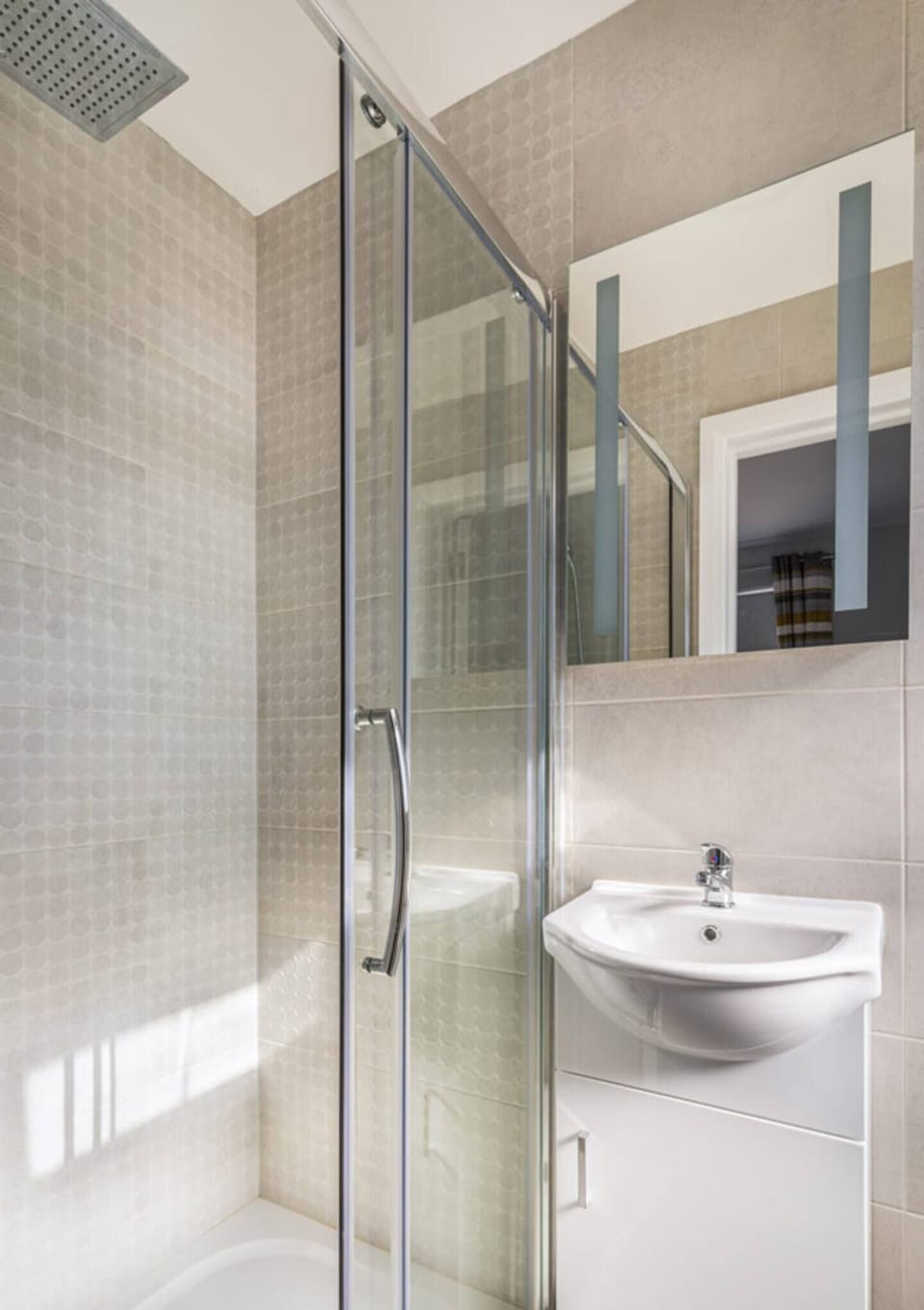 Shower and sink. Hairdryer included below sink.