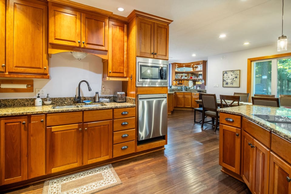 Full kitchen includes cooktop, double ovens, dishwasher, refrigerator, microwave, and more!
