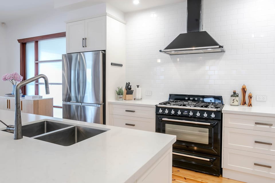 Custom-built kitchen with Smeg 900 free standing oven with 5 burner gas cooktop.