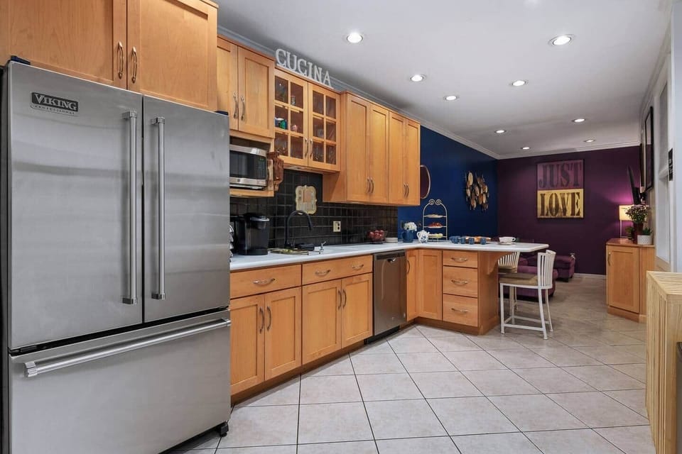 Stylish and well-lit kitchen with modern appliances.







