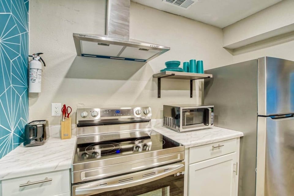 Kitchen includes Keurig Coffee maker, plates, pots, pans, and silverware for all your cooking needs.