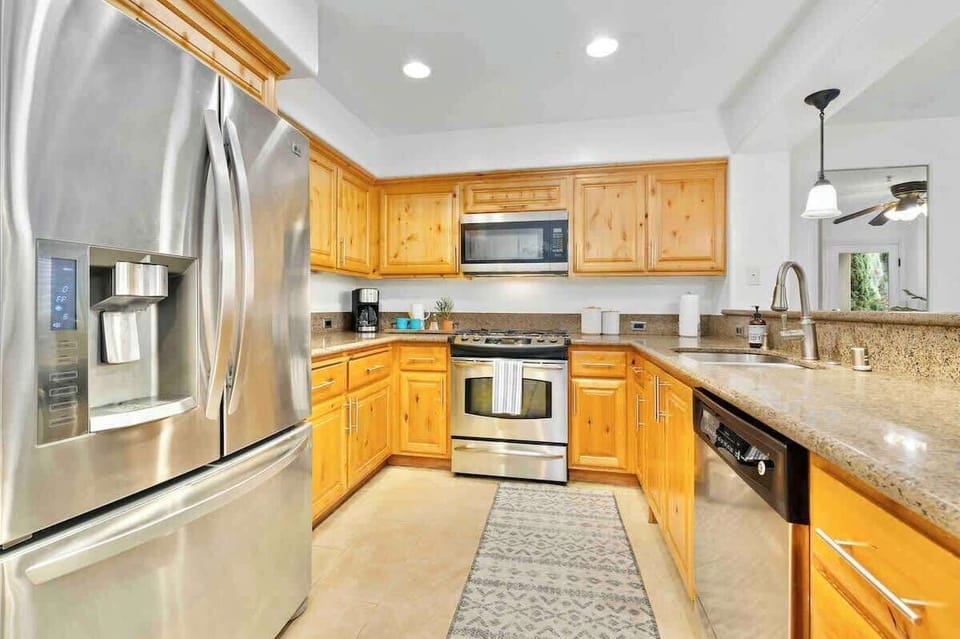 The kitchen has designer stainless steel appliances, granite countertops, travertine floors etc. All dishes, pots, and pans are provided for you.