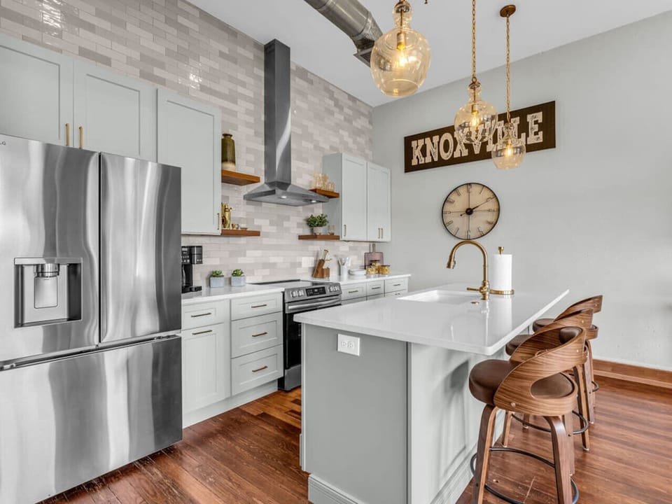 Gourmet Kitchen: Stylish design with chic lighting, sleek appliances, and ample space for cooking fun!