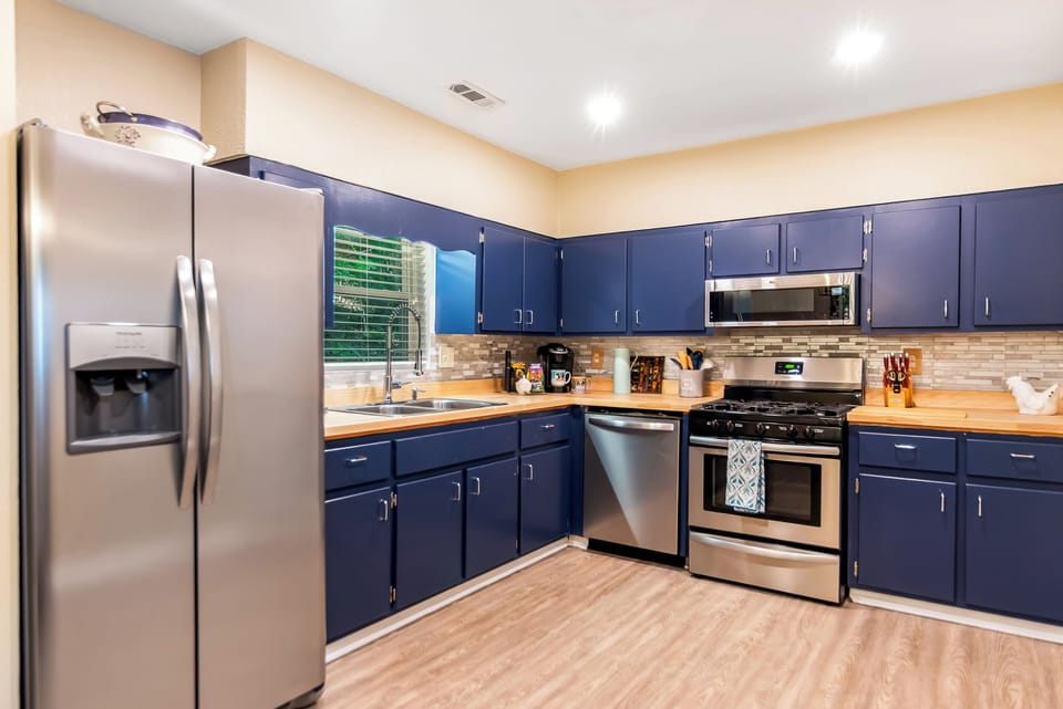 Spacious kitchen with all cooking utensils needed to make delicious meals.