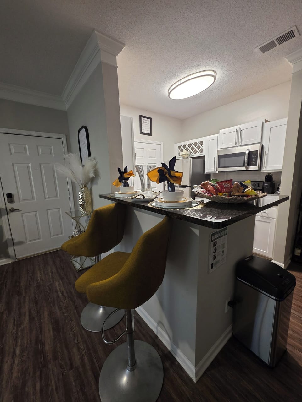 Kitchen peninsula with sink and bar seating great for dining or conversation.