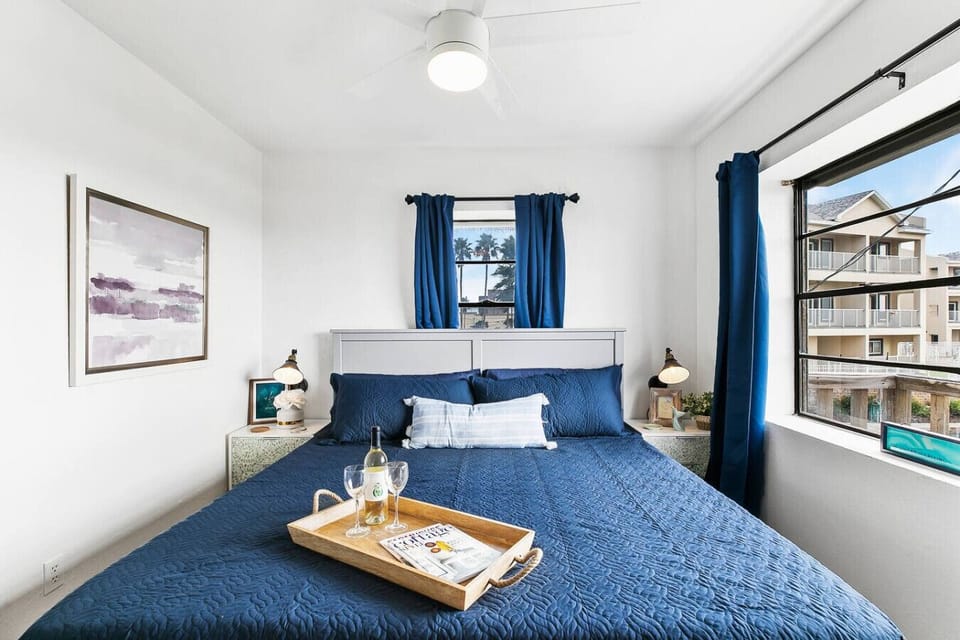- Spacious master bedroom with dual windows - King bed, soft linens and calming blue palette - Tranquil beach getaway close to ocean views