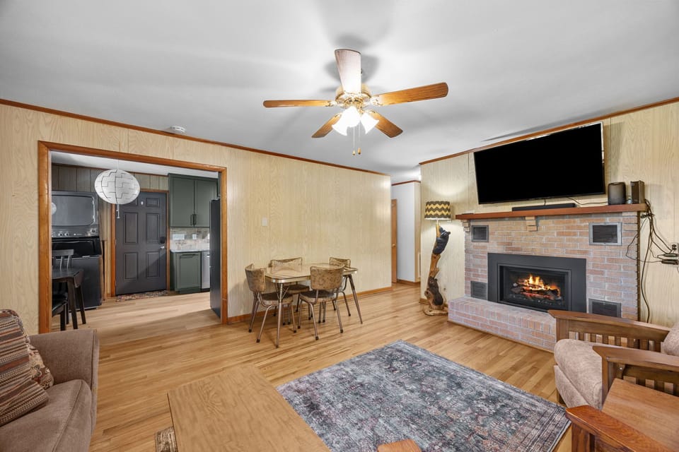 Cozy living room offers comfortable furnishings to sit down and enjoy time with your loved ones, watching a movie, or playing games. The gas log fireplace is available to warm you up during the winter months.