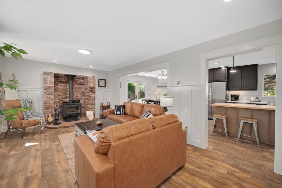 Living Room | Wood Stove w/ Firewood Provided | Open to Kitchen & Dining