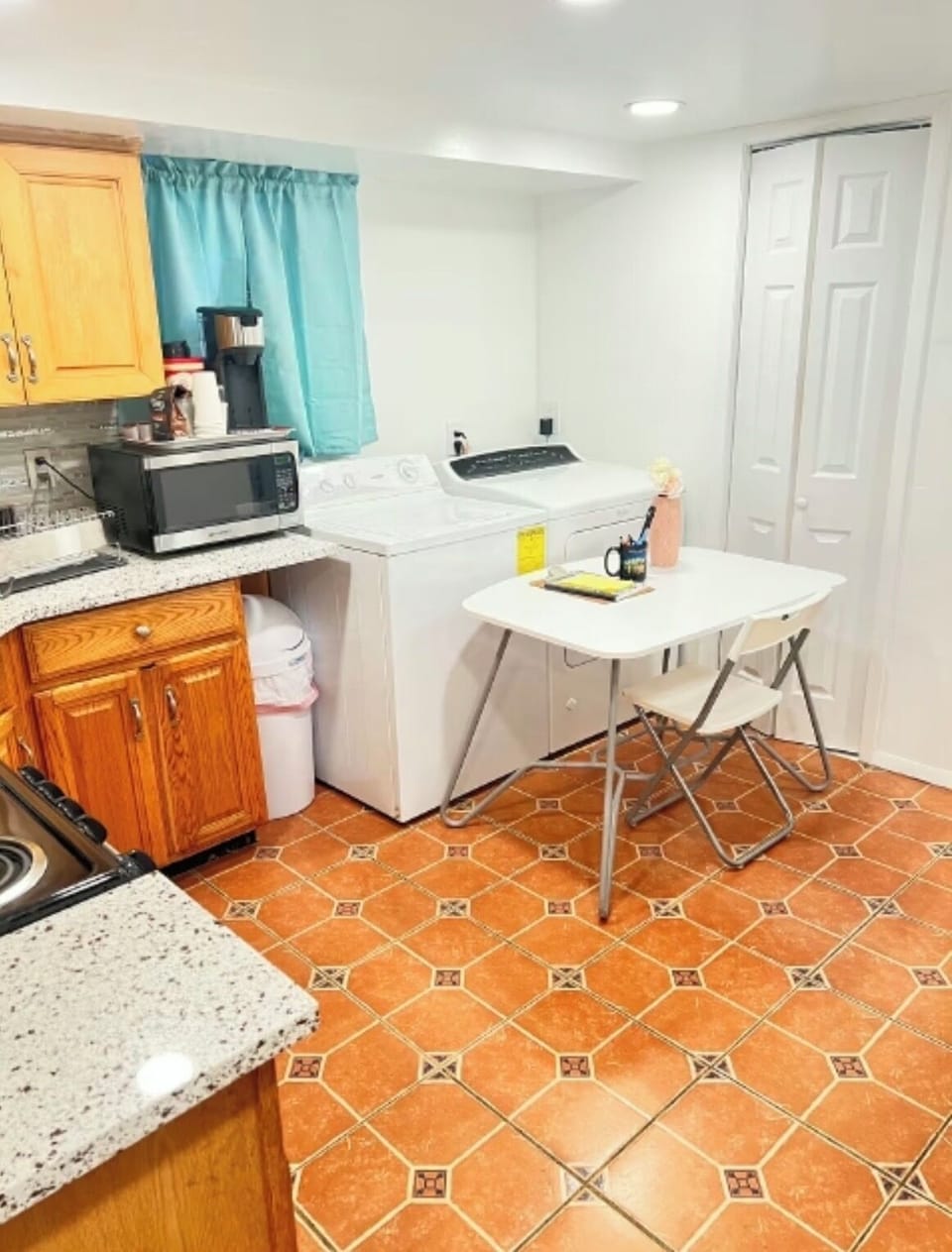 Kitchen with washer and dryer.