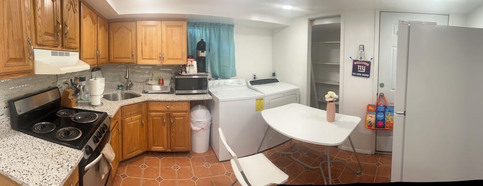 Full kitchen with washer and dryer.