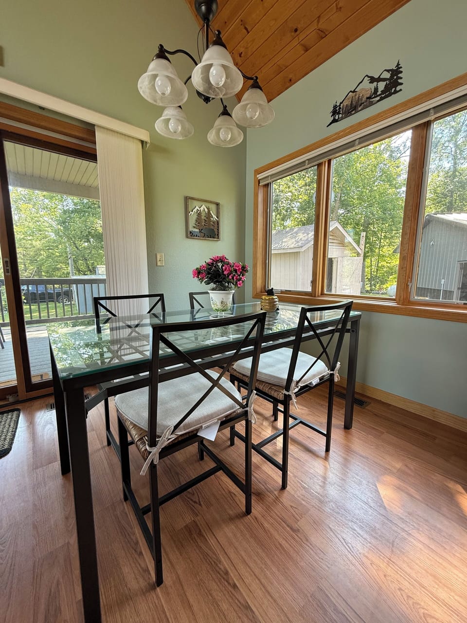 Looking out the kitchen table area toward the large covered deck