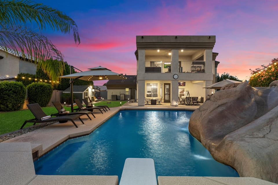 Resort-style pool with rock waterslide