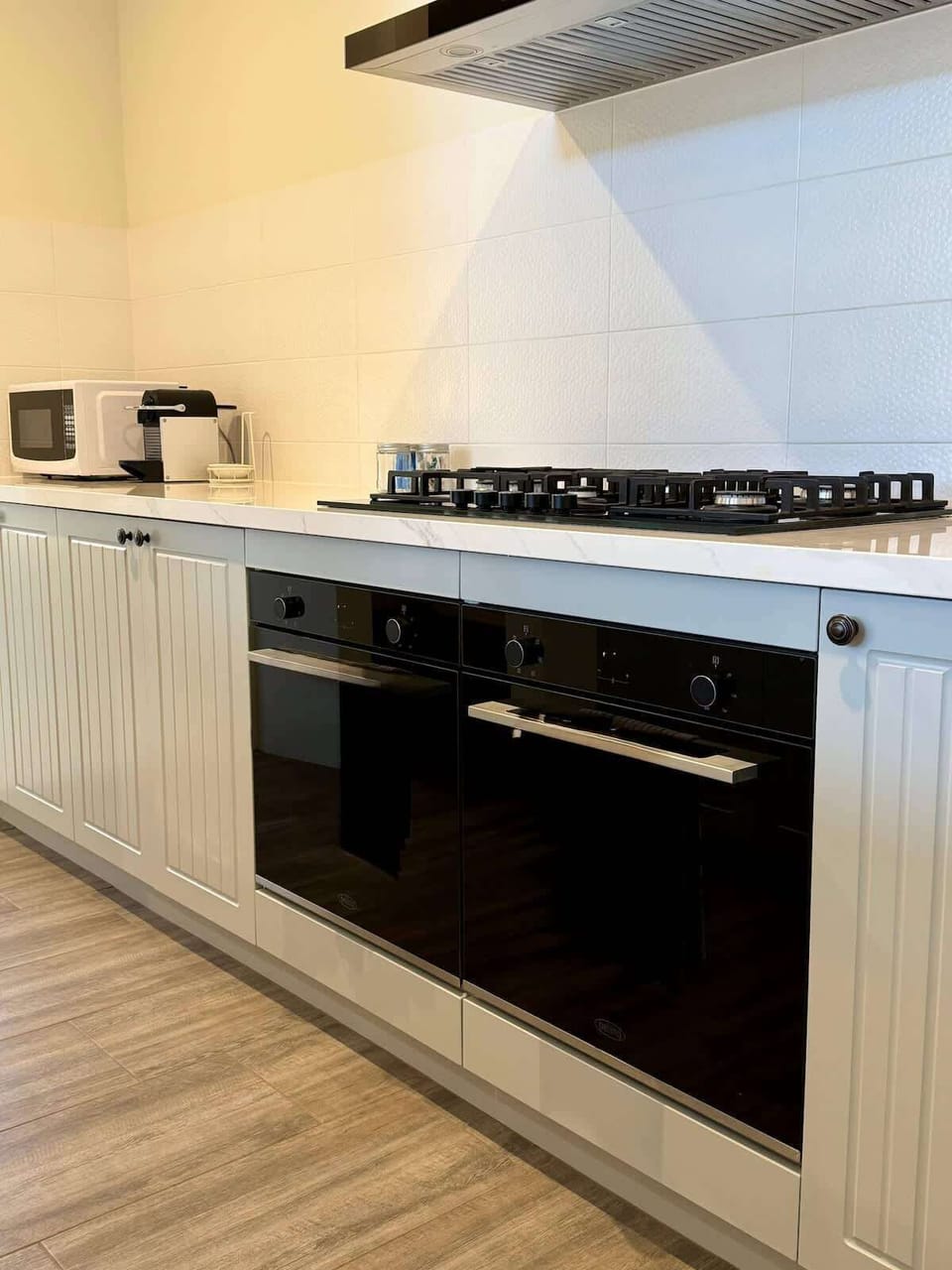 Chef's kiss! This kitchen is ready for your culinary adventures. Featuring a gas cooktop, two built-in ovens, a microwave, and ample counter space. Get ready to cook up some unforgettable memories!