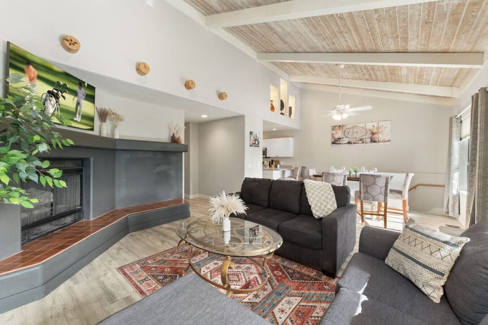 Modern cozy space with fireplace and TV for all moods.