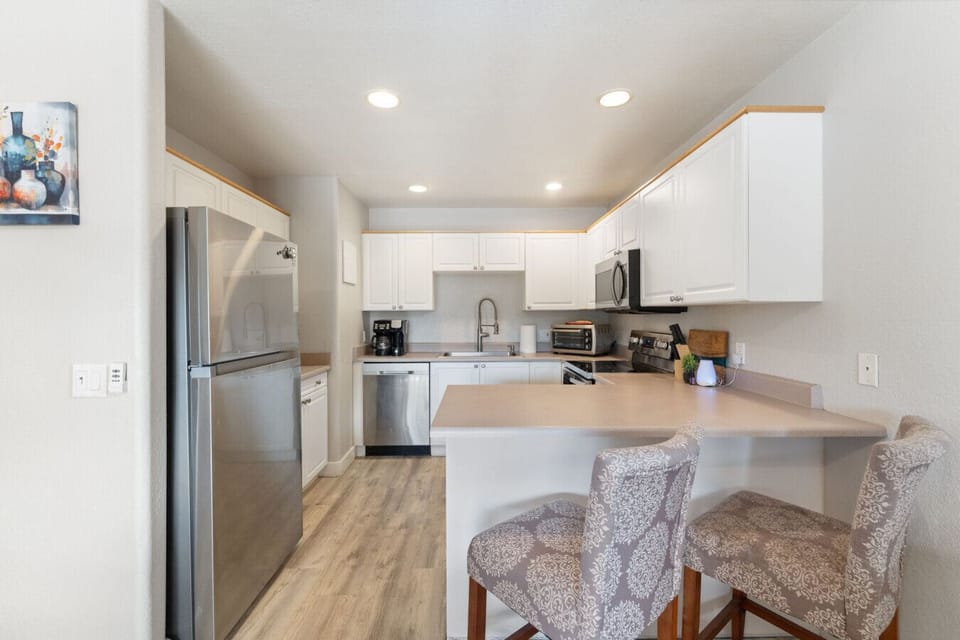Modern kitchen vibes with sleek finishes and cozy charm.