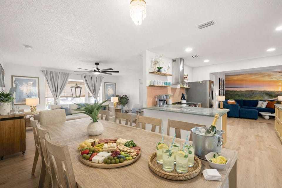 Dining Area: With seating for 10, this central gathering space connects the living room and kitchen, making it easy for everyone to come together for breakfast, lunch, dinner, games, and quality time during your stay.