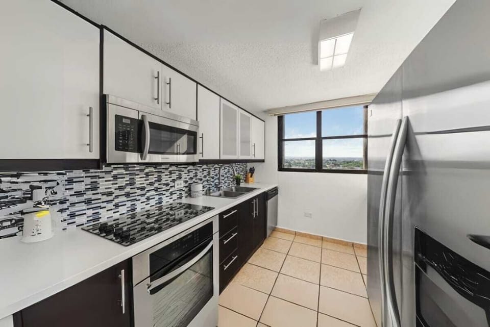 Sleek kitchen with natural light; perfect for morning coffee.