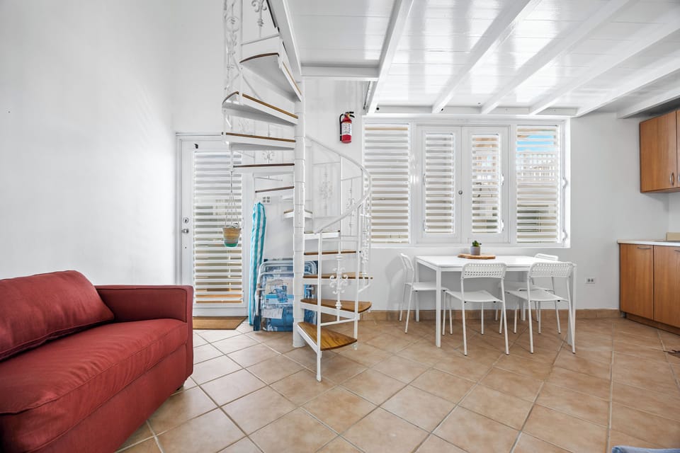 A perfect spot for dining next to a fully equipped kitchen.