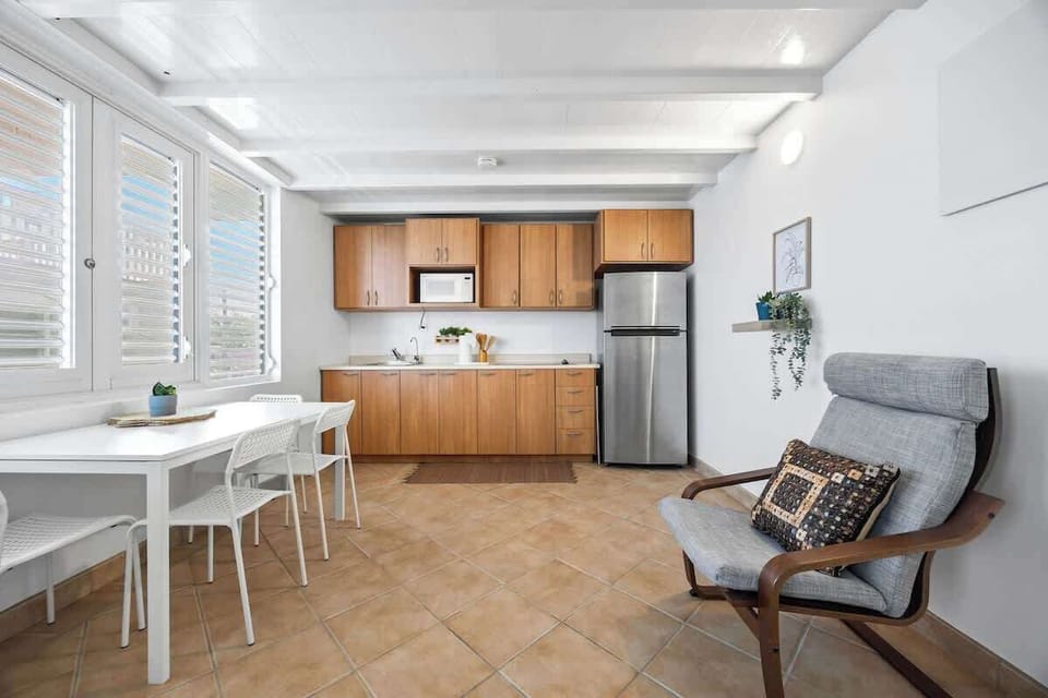 A fully equipped kitchen with a counter for food prep.