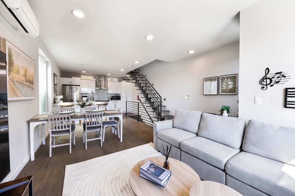 Bright open floor plan seamlessly connects the living, dining, and kitchen spaces.