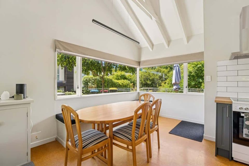 Sun filled dining space with table and chairs