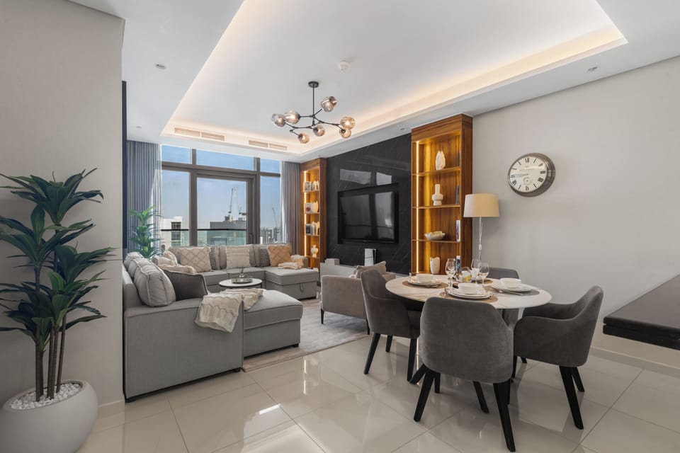Spacious living room with comfy seating and city views.