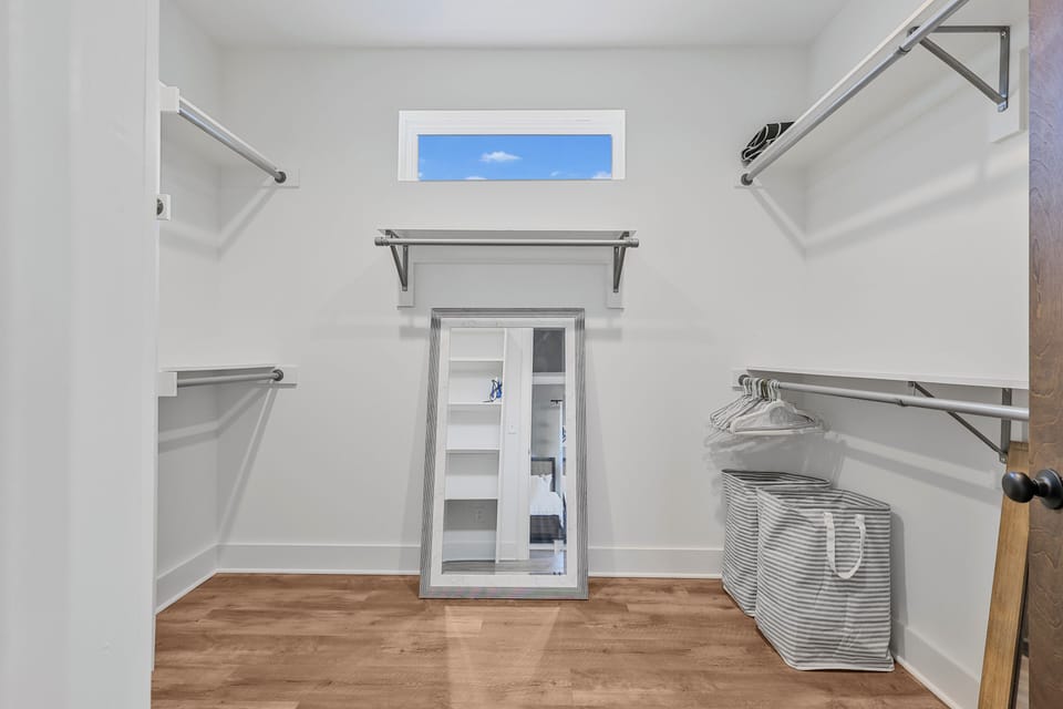 Walk-in closet with built-ins in primary Nashville suite