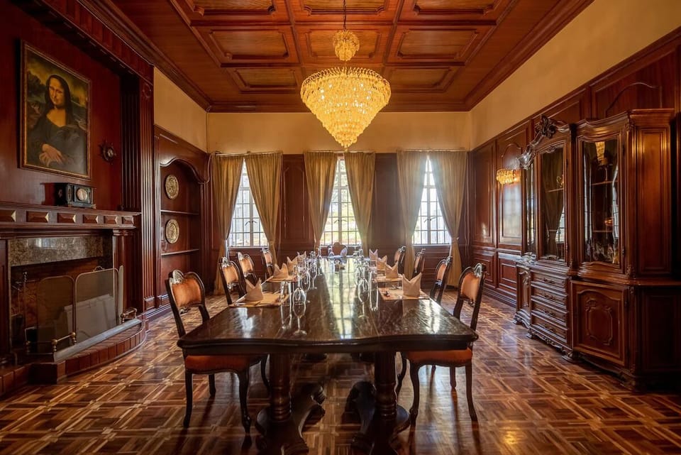 Host intimate conversations amid rich wood columns and soft chandelier glow.