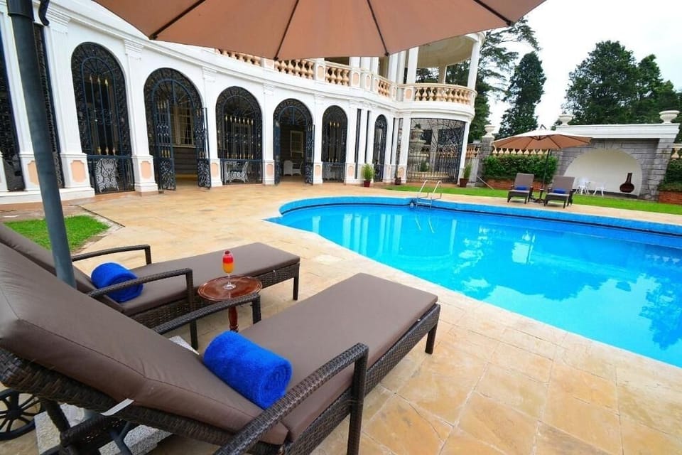 Sip something cold while relaxing on plush pool loungers.