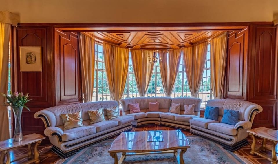 Sip tea by sweeping windows in an elegant, cozy lounge.