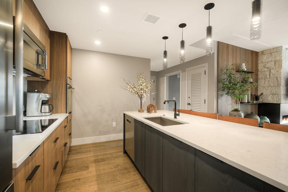 Modern kitchen with sleek appliances and ample counter space, ready for home-cooked mountain meals.
