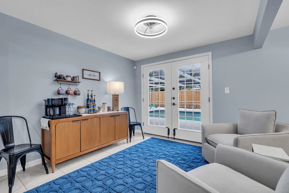 The coffee bar + sitting area, with french doors leading directly to the pool!