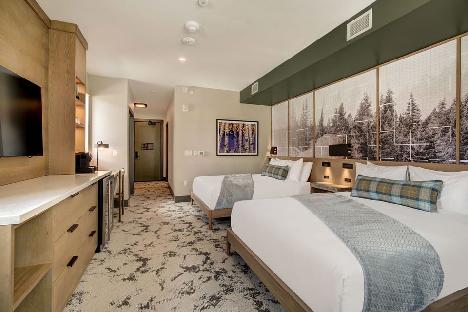 Cozy queen beds and a warm, inviting atmosphere await you here.