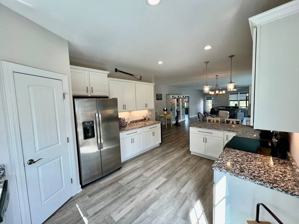 Spacious kitchen with all new appliances, cooking essentials, and large pantry.