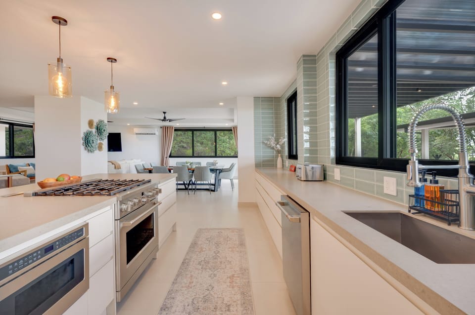 Kitchen flows seamlessly into the dining room for effortless entertaining.
