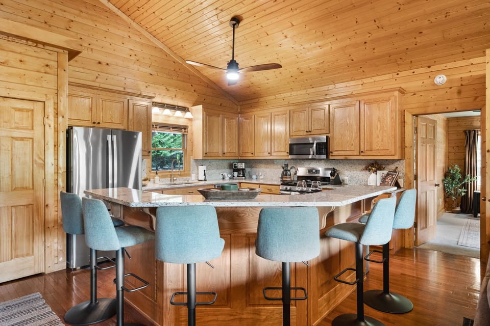 Additional kitchen bar seating for 6. Room for all to swap snacks and stories.