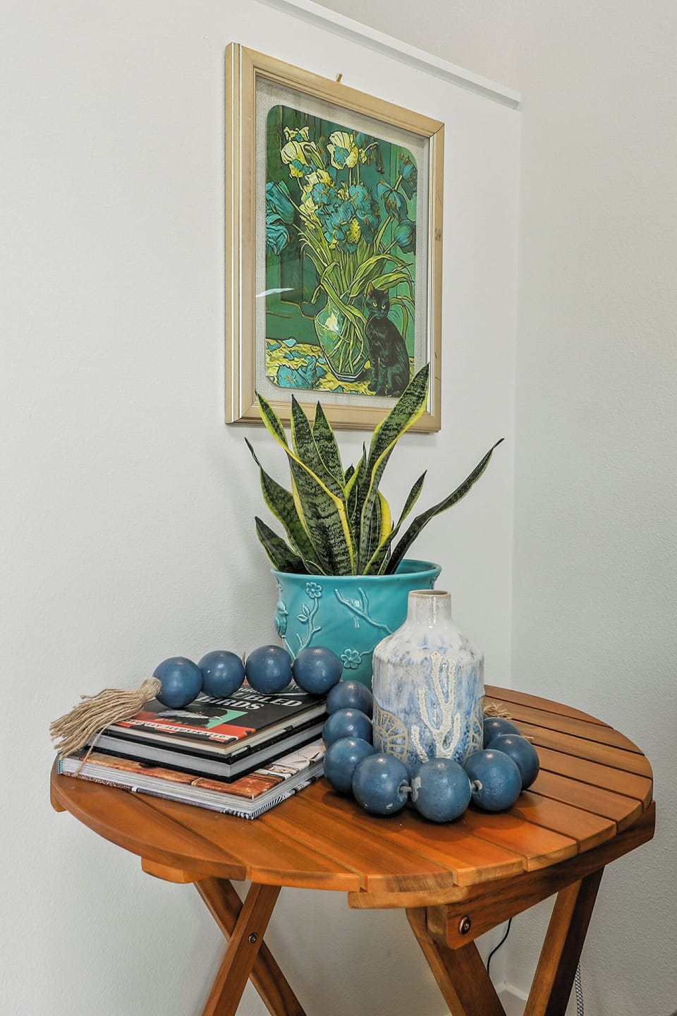 Curated designer details: thoughtfully selected art and greenery to create a pea