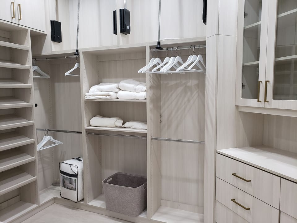 Walk in wardrobe in primary suite