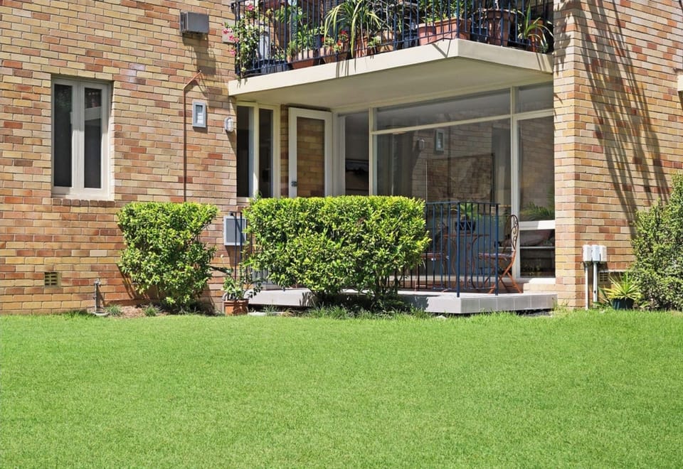 Sunny Balcomy opening onto grass area.