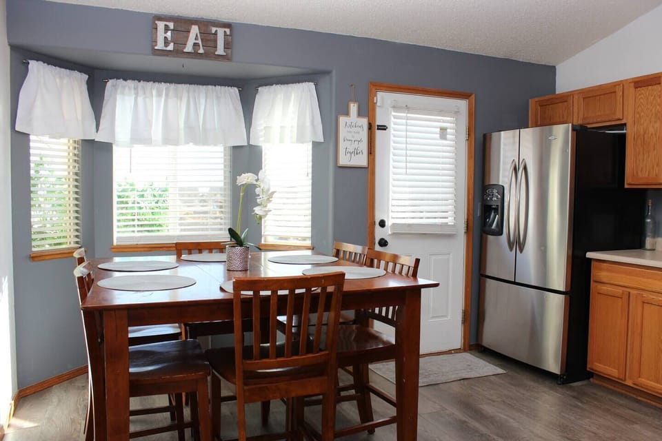 Dining table in the kitchen with seating for up to 8 guests.