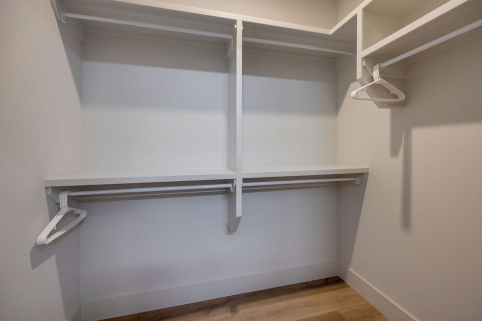 Unit 1: Primary Bedroom walk-in closet.